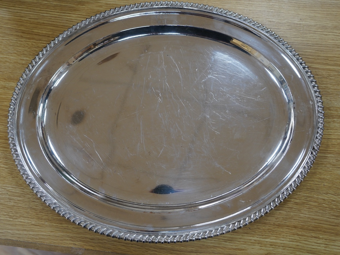 Two 19th century Old Sheffield plate oval meat plates, with gadrooned borders, largest 58.2cm. Condition - plate worn and scratched